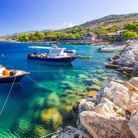 Floating fishing boats at a beautiful coast of Zakynthos (Zante) island Floating fishing boats at a beautiful coast of Zakynthos (Zante) island